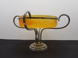 a glass vase that is sitting on a table