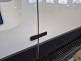 a close up of a white van with a sticker on it