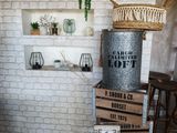 boxes stacked on top of each other in front of a brick wall