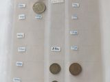 a lot of coins in a plastic bag on a table