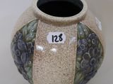 a small vase with a number on the side of it