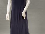 a mannequin wearing a blue dress with black trims