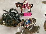 several figurines of soldiers on display in a display case