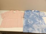 pair of pink and blue tie dye shirts sitting on a table