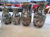 many vases that are sitting on a table