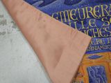 a close up of a tie with a design on it