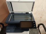 a printer that is sitting on top of a cart