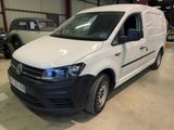 the white van is parked in a garage with other vehicles