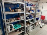 many shelves with various tools on them in a garage