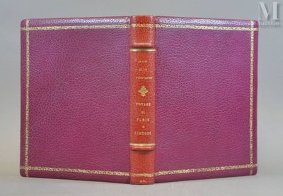 a close up of a purple book with a red cover