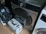 a washer and dryer sitting on the floor next to each other