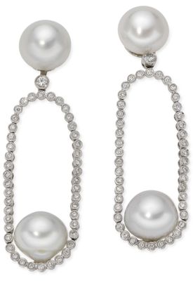 a pair of pearl and diamond earrings