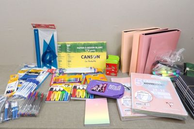 a table with many school supplies and supplies on it