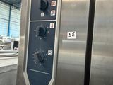 an image of a stainless steel refrigerator in a warehouse
