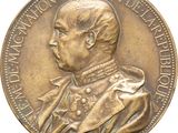 une image représentant une médaille de bronze sur laquelle figure le portrait d'un homme