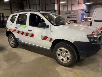 a picture of a white pick up truck parked in a garage