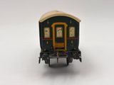 a toy train car with a clock on the side of it
