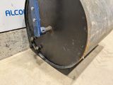 a large metal barrel with a blue handle on it