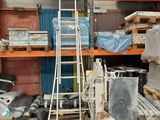 a ladder that is leaning against a wall in a warehouse