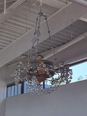 a chandelier hanging from the ceiling of a house