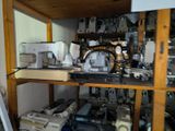 many different types of sewing machines in this room
