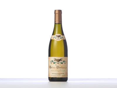a close up of a bottle of wine on a table
