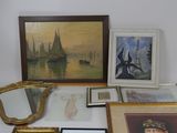 une table sur laquelle sont posées de nombreuses photos encadrées et d'autres photos