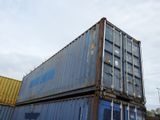 a large blue container sitting on top of a truck