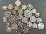 a lot of coins that are on the table