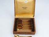 gold plated spoons and spoons in a case with a gold lining