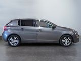 a picture of a silver car parked in a garage