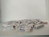 several boxes of toothpaste sitting on top of a white counter