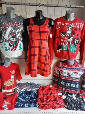 a display of ugly sweaters on display in a store