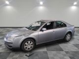 a picture of a silver car parked in a garage