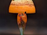 a lamp that is sitting on a table next to a black background