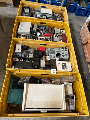 many different types of electronic equipment in the bins