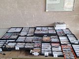 a table that has a lot of cds on top of it