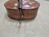 a wooden box with a handle on it on the floor