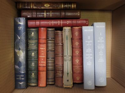 a box full of books that are sitting on a shelf