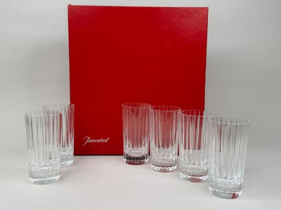 four glasses and a red box on a white surface