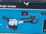 packaging of a cordless angle grinder sitting on the ground