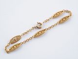 an image of a gold chain bracelet with a clasp