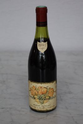 a bottle of wine that is sitting on a table