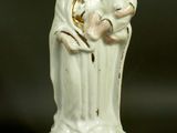 a figurine of a woman holding a child