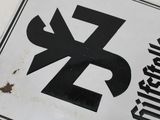 a white sign with a black and white design on it