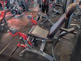a large gym with a lot of machines in it