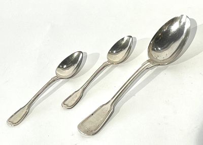 four spoons and two spoon spoons on a white surface