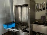 a large stainless steel oven in the corner of a kitchen