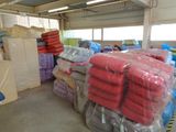 a large pile of blankets and blankets in a warehouse