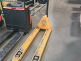 a forklift and a pallet in a warehouse